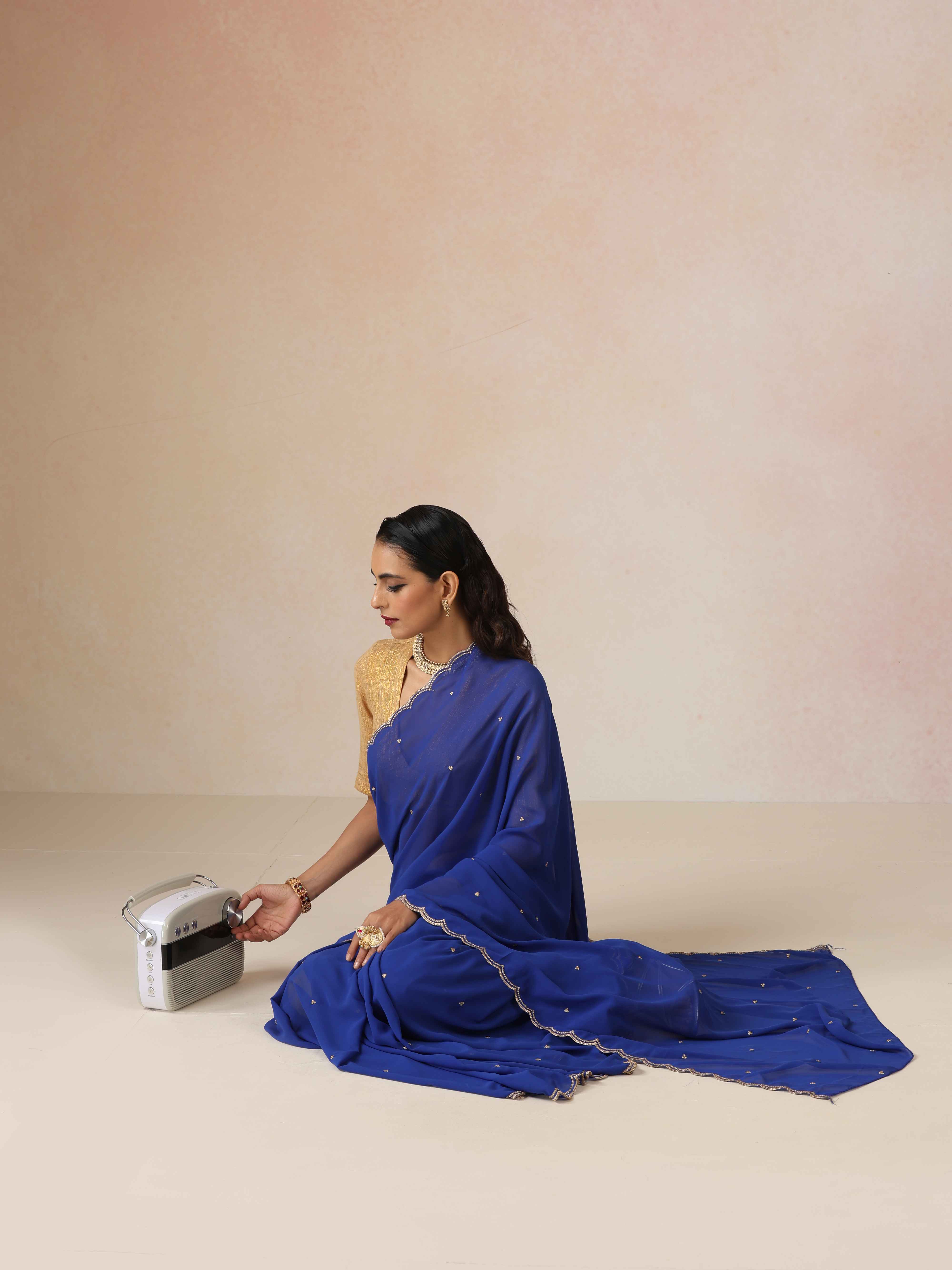 trueBrowns Blue Georgette Embroidered Saree With unstitched Blouse