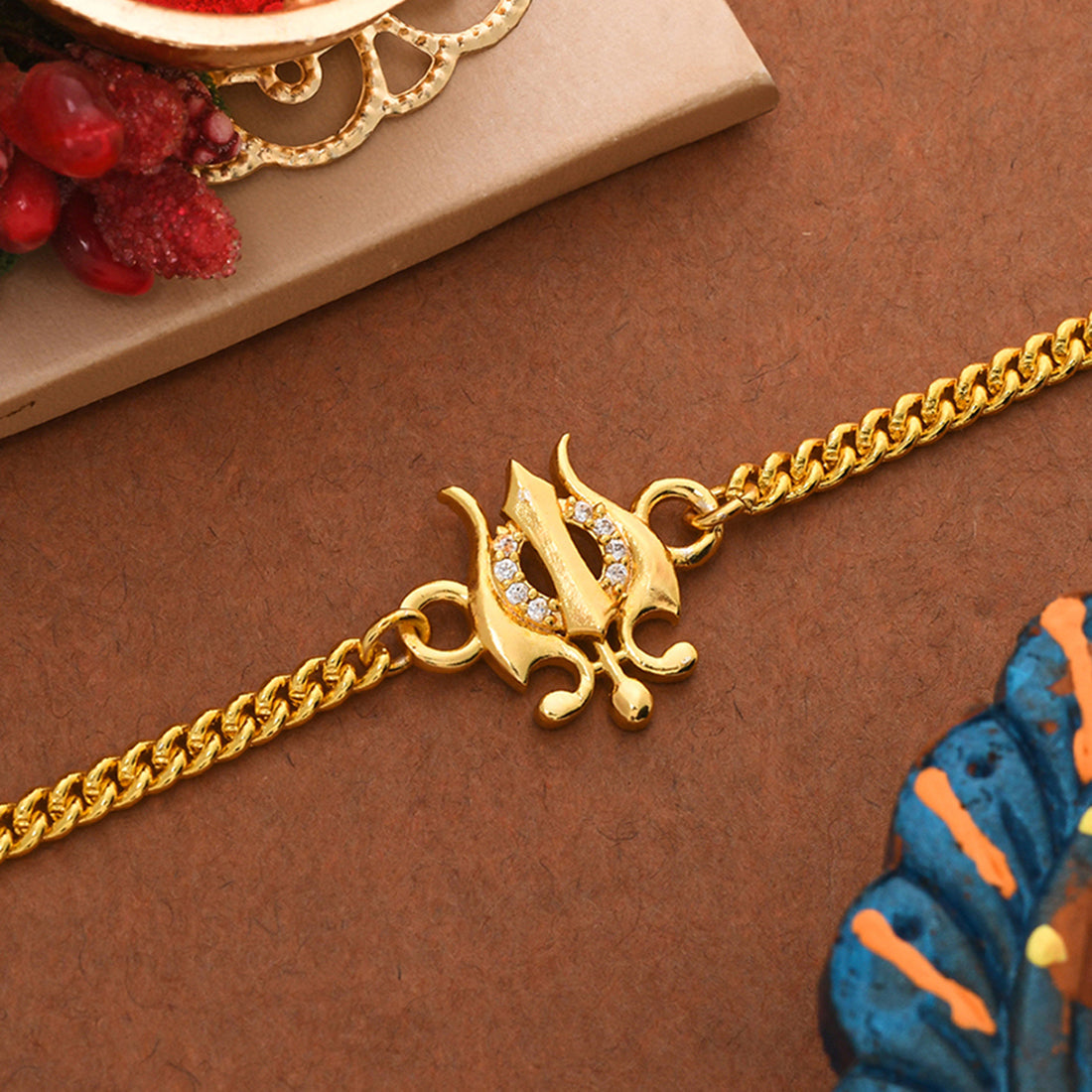 trueBrowns Yellow Gold Plated Trishul Bracelet Rakhi